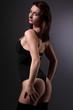 Foto: Sexy young girl posing in black lingerie Sexy young girl posing in black lingerie