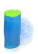 Foto: A wet bottle of shower gel shampoo and sponge A wet bottle of shower gel shampoo and sponge