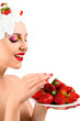 Woman eating strawberry