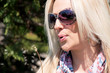 Photo: Woman blowing dandelion Woman blowing dandelion