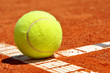 Tennis ball on a tennis clay court