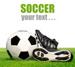 soccer ball and shoes in grass