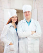Portrait of friendly doctors in clinic