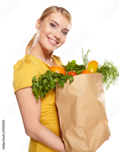 Photo: Young woman with a grocery shopping bag. Isolated on white backg Young woman with a grocery shopping bag. Isolated on white backg