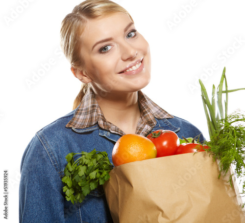Photo: Young woman with a grocery shopping bag. Isolated on white backg Young woman with a grocery shopping bag. Isolated on white backg