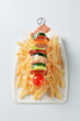 Foto: Pork skewer and French fries Pork skewer and French fries