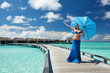 Woman on a beach jetty at Maldives