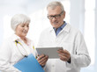 Smiling Doctor and Nurse with Digital Tablet