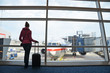 Foto : Girl at the airport window Girl at the airport window