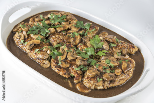 Photo: Platter of Chicken Marsala on a white background Platter of Chicken Marsala on a white background
