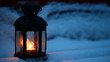 Candle lamp on snowy bench at dusk