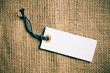 Photo: blank price tag label on burlap background blank price tag label on burlap background