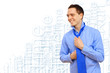 Photo: Young business man binding his blue tie Young business man binding his blue tie