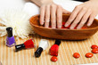 Foto: Woman is getting manicure Woman is getting manicure