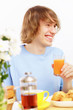 Young man drinking juice