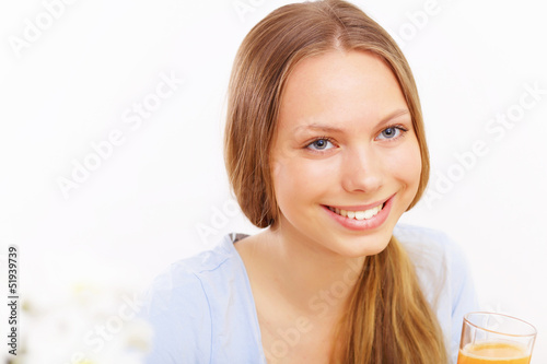 Photo: Beautiful young woman drinking tea Beautiful young woman drinking tea