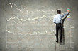 businessman drawing diagram