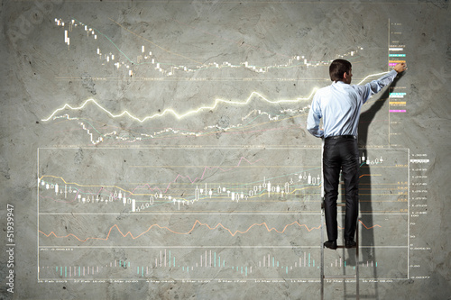 Photo: businessman drawing diagram businessman drawing diagram