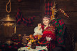 Russian beauty before Christmas in a wooden interior