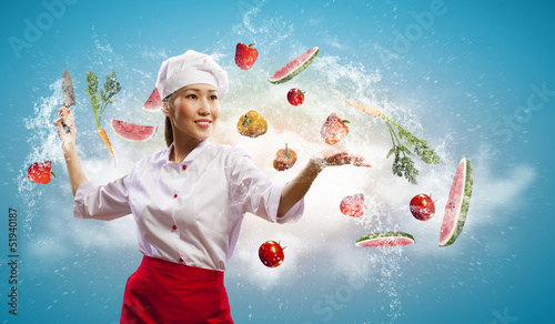 Photo: Asian female cook with knife Asian female cook with knife