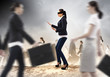 Businesswoman in blindfold among group of people