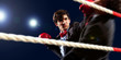 Two young businessman boxing