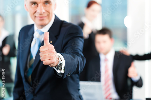 Photo: Business - team in an office Business - team in an office