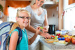 Photo: Family - mother making breakfast for school Family - mother making breakfast for school