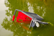 Shopping cart abandoned on the river