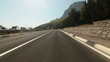 Driving car on mountain road along the coast