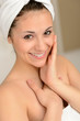 Photo: Smiling young woman wrapped in towel Smiling young woman wrapped in towel