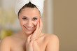 Photo: Cheerful young girl smiling wrapped in towel Cheerful young girl smiling wrapped in towel