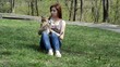 girl stroking a red puppy