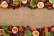 Mixture of dried fruits lying on sackcloth