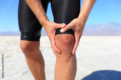 Photo: Injuries - sports running knee injury on man Injuries - sports running knee injury on man