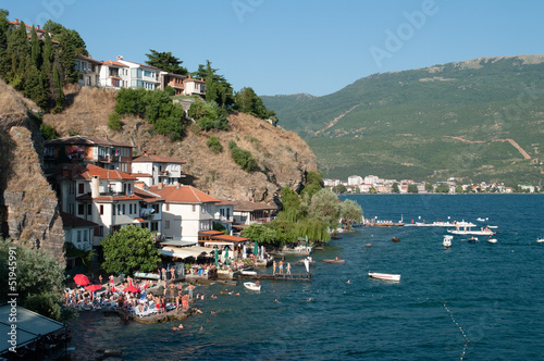 Kaneo beach in Old Ohrid crowded with sunbathers on the beaches of its lake