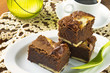 Cream cheese brownies on a white plate