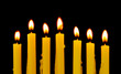 Photo: Burning candles isolated on black background Burning candles isolated on black background