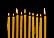 Photo: Burning candles isolated on black background Burning candles isolated on black background