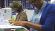 Close Up Of Woman Sewing Using Electric Machine