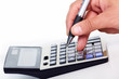 Foto: Hand with a calculator. Hand with a calculator.