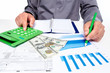 Hands of businessman with calculator.