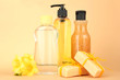 Liquid and hand-made soaps on beige background