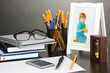Photo: White photo frame on office desk on grey background White photo frame on office desk on grey background