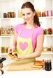 Young woman cooking in kitchen