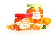 Orange jam with zest and tangerines, isolated on white