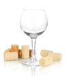 Wineglass and corks isolated on white