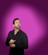 Photo: Young bearded businessman buttoning his shirt button Young bearded businessman buttoning his shirt button