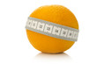 Orange fruit wrapped with measuring tape