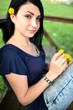 young teenager blowing a dandelion